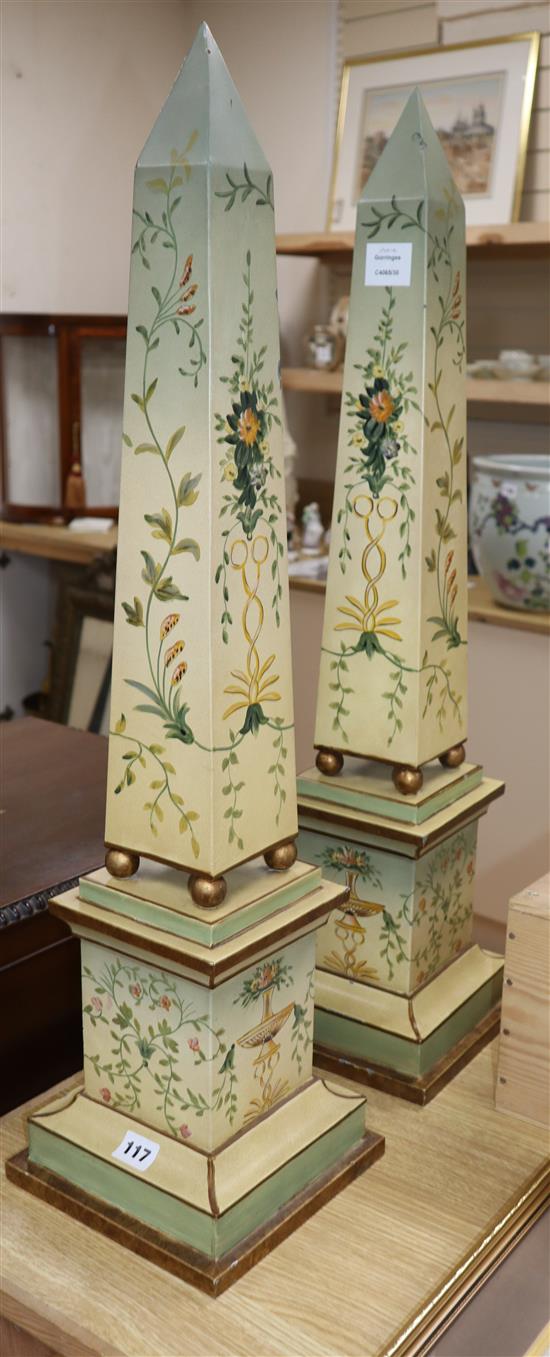 A pair of painted and decorated wooden obelisks height 80cm